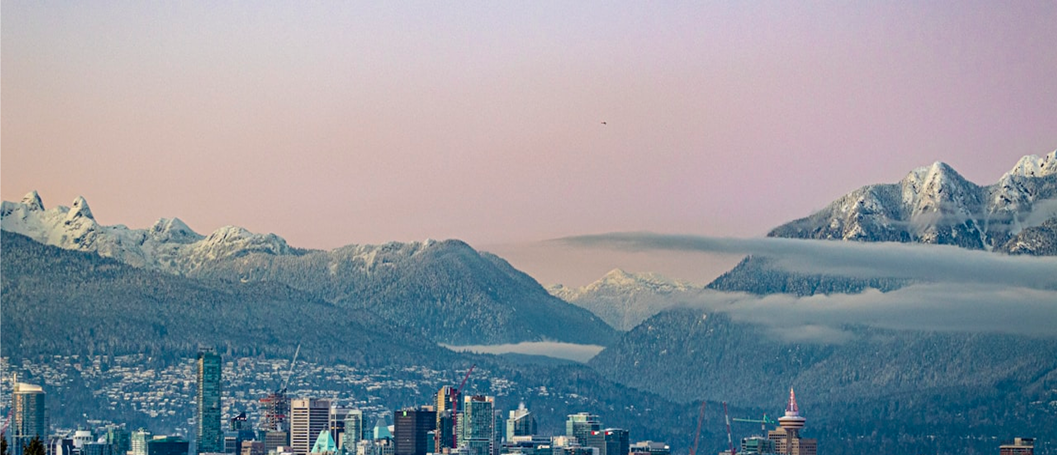 Snow-covered North Shore mountains above the Vancouver skyline